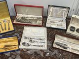 a lot of silverware in a case on a table
