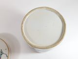 a cup and saucer sitting next to each other on a table
