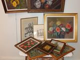 many framed pictures of flowers and fruit on a table