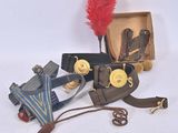 a box with some items on it and a red feather