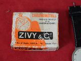 an image of a watch sitting next to a box of cigarettes