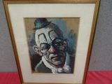 tableau représentant un clown portant un haut-de-forme et des lunettes, dans un cadre doré