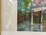 une aquarelle représentant un vase de fleurs posé sur une table
