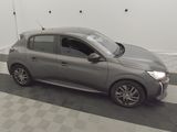 a picture of a grey car parked in a garage