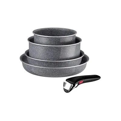 a stack of three pans and a knife on a white background