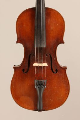 an old violin with a bow hanging from it ' s back