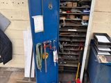 a blue cabinet with tools in it next to a blue trash can