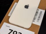 a box with a white iphone on it on a table