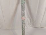 a close up of a metal pole with a plastic wrap around it