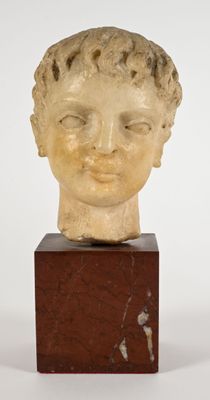 marble head of a young boy on a marble block