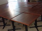 four tables that are sitting in front of a fire place