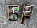 two wooden boxes that have some items inside of them