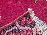 an image of a close up of a rug with a cat on it