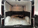 the back of a white van with the door open