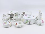 many plates and bowls that are sitting on a table