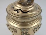 gold plated incense box with a dog on top