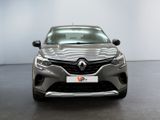 the front view of a grey car in a showroom
