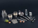 a lot of silver items that are on the table