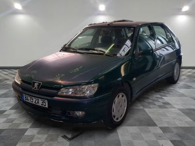 a picture of a green car parked in a garage