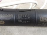 an image of a close up of a black tube with wires