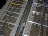 two ladders that are attached to the side of a building