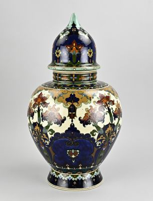 an image of a blue and white vase with flowers on it