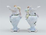pair of porcelain figurines of a woman and a man on a horse