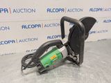 a green and black machine sitting on top of a table
