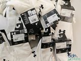 many pairs of white socks on display in a store