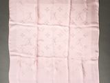 an image of a pink handkerchief on a table