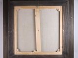 an old picture frame with a piece of wood sticking out of it