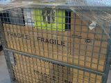 a metal cart with a plastic cover on top of it