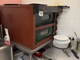 a kitchen with a sink, microwave, and other items on the counter