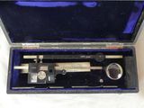 a box with a caliper in it on a table