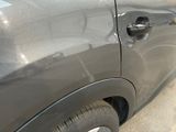 a car that has a hole in the side of it