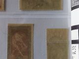 three different stamps on a piece of paper with a black and white stripe