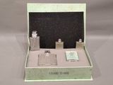 a small box with a lot of perfumes inside of it
