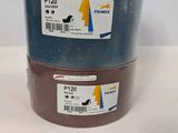 two rolls of brown and blue tape sitting on top of each other