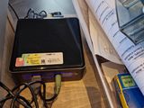 a table with a lot of electronic items on it