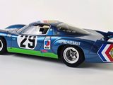 a model of a blue race car on a white surface