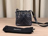 chanel black quilted leather bucket bag