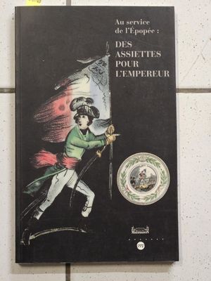 french book on the wall of a public restroom with a picture of a man holding a flag