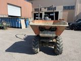 a tractor that is parked in a parking lot