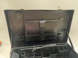 a black briefcase with a bunch of compartments inside of it