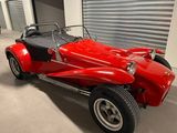 an image of a red car parked in a garage