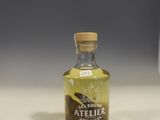 a bottle of olive oil sitting on a counter