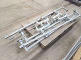 a lot of pieces of metal sitting on a pallet