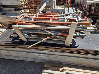 a pile of wood sitting on top of a pile of pallets
