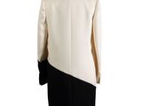 a white and black coat with black trims on a mannequin mannequin mannequin mann