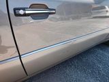 a close up of a car door handle on the side of the car